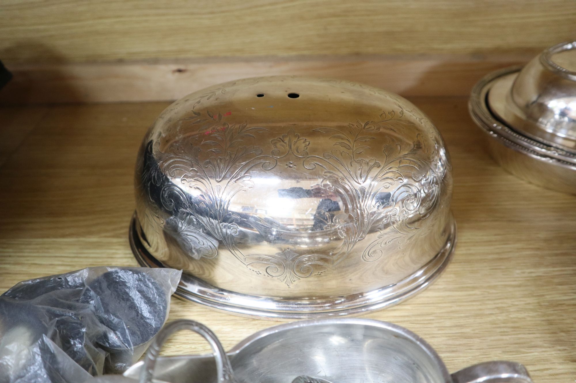 A quantity of plated items, including entree dishes and covers,